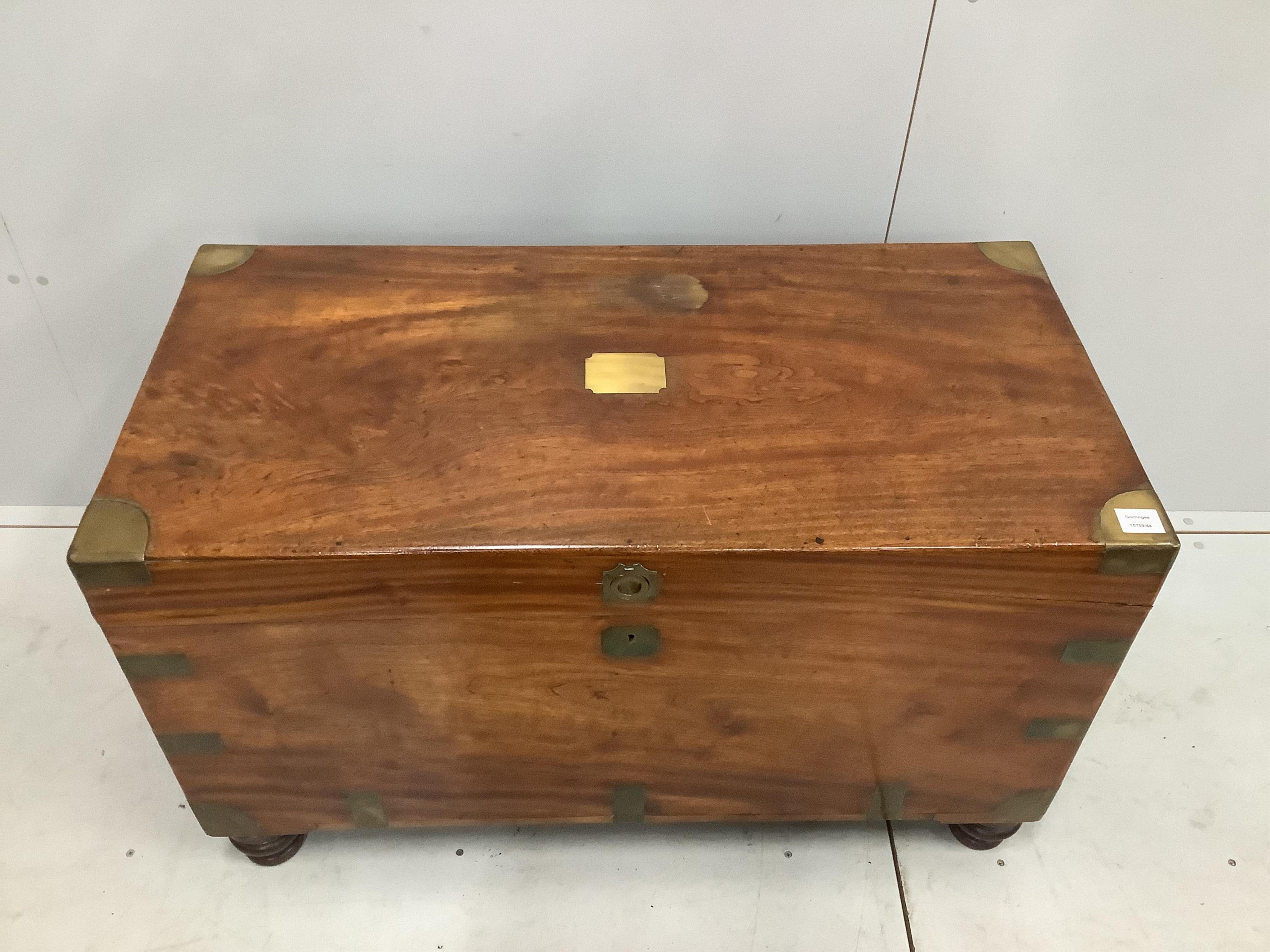 A 19th century camphorwood and brass bound campaign chest, with internal trays, on turned feet, width 106cm, height 64cm. Condition - good
